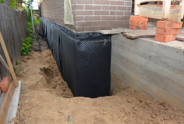 Happy homeowners after waterproofing job in East Pembroke